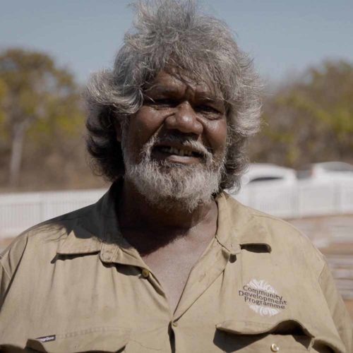 Angus Knight - Community - Image of a first nations man to a youth